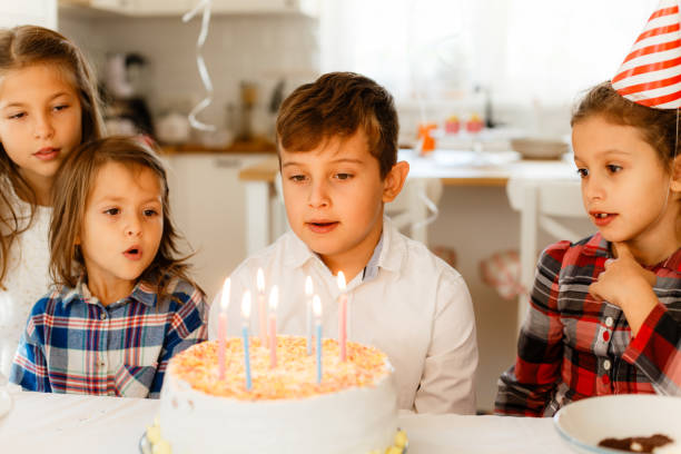 istock Boy blowing the bIrthday candles 1840741457