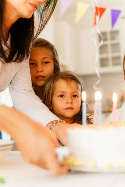 istock Mother bringing the Birthday cake on the table 1840742983