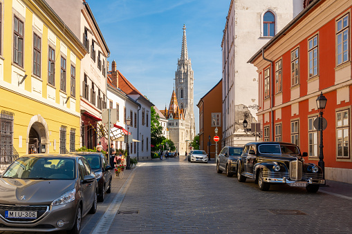 Budapest, Hungary - April 2019: Streets of Buda and Matthias church at background