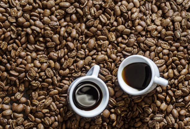 istock Two espresso cup on coffee beans background above 1840772646