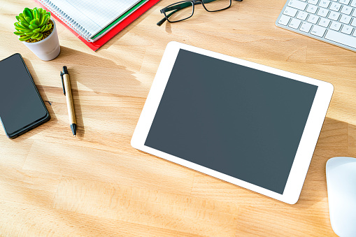 Digital tablet on wood desk