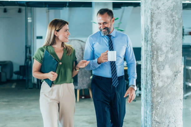 istock Business colleagues talking in the office 1840791730