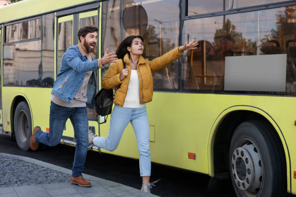 istock Being late. Worried couple running towards bus outdoors, space for text 1840809487