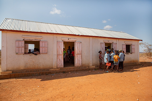 Miandrivazo, Madagascar 20 october 2023. students of Madagascar school rush to class, enter building of village one-story school .