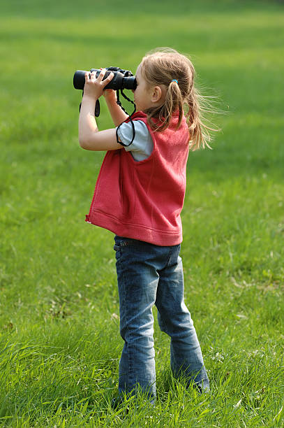 istock Little girl on green field 184084646