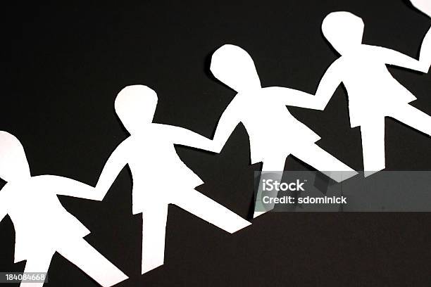 Paper People On Black Stock Photo - Download Image Now - Art, Art And Craft, Attached