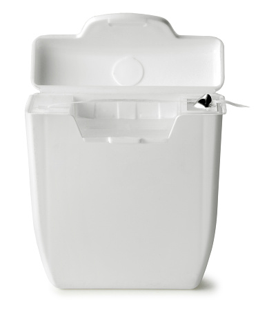 Dental floss container on white with soft shadow