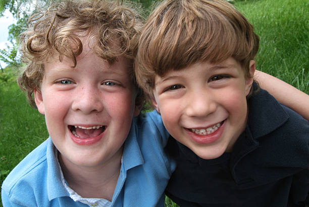 istock Happy Brothers Laughing and Hugging Outside in the Summer 184084808