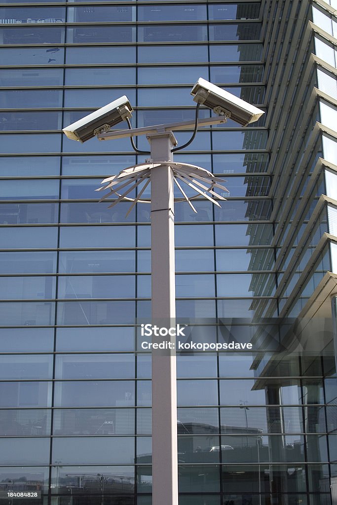 CCTV CCTV cameras on a pole outside corporate building Big Brother - Orwellian Concept Stock Photo