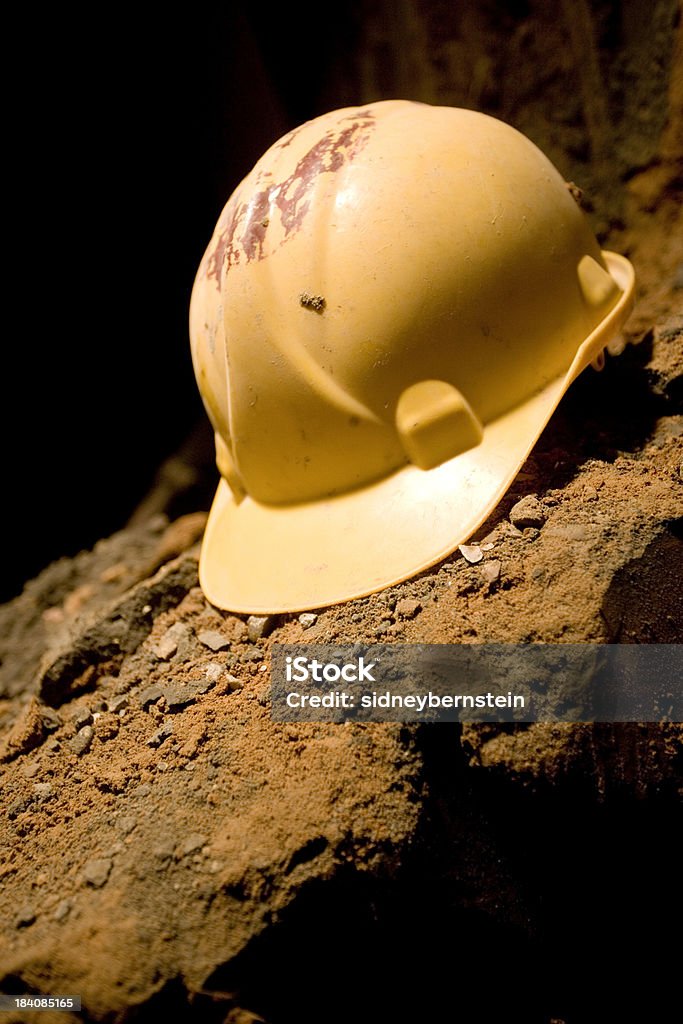 Hardhat Workman's hardhat on rough brick/dirt surface. Canon 1Ds Mark 2 file Law Stock Photo