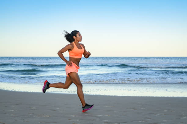 istock Woman doing sports training drill on the beach 1840852988