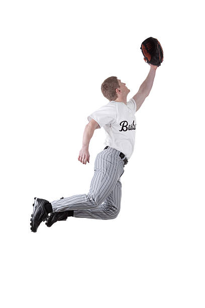 istock Baseball fielder jumping to catch the ball 184086041