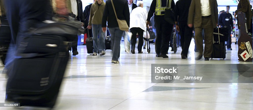 Airport People A ground level view of people in an airport. Airport Stock Photo