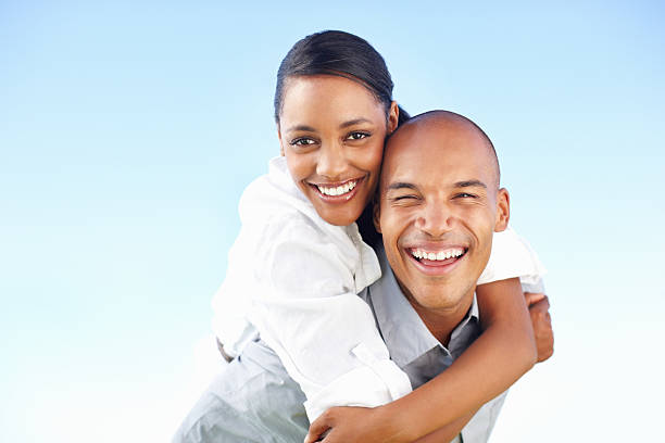istock Happy couple enjoying piggyback ride 184086731