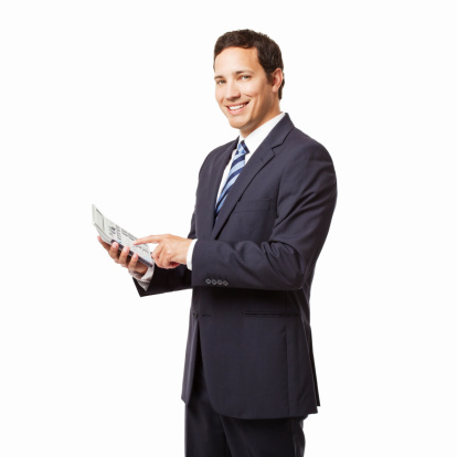 Young businessman poses with a large calculator in his hands. Square shot. Isolated on white.