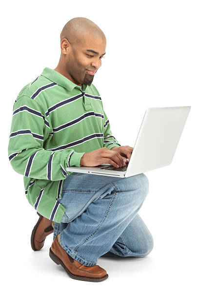 istock Cheerful African American Man with Laptop on Knee 184086848