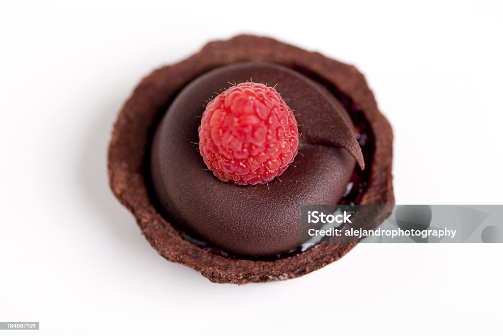 Raspberry chocolate tart Delicious decorative raspberry chocolate tart with chocolate frosting on white Baking Stock Photo