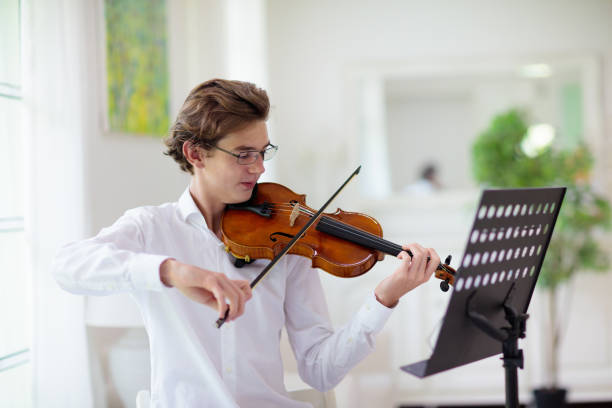 istock Man playing violin. Classical music instrument. 1840874062