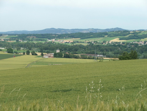 A valley in a rural area under the cloudy sky