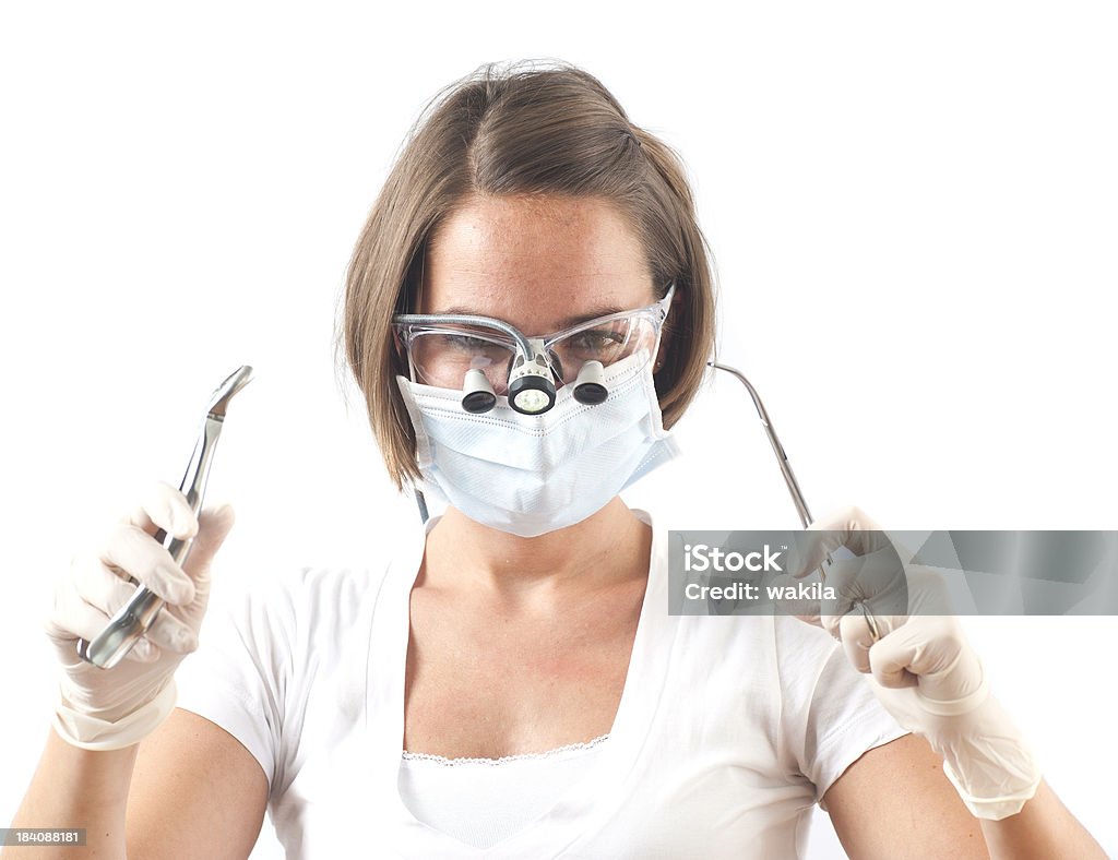 Professional dentist female dentist before white background Adult Stock Photo