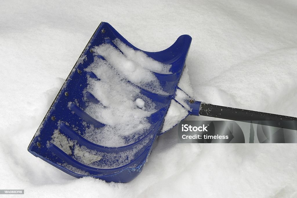 resting snow shovel This snow shovel was taking a break during the dig out. Assistance Stock Photo