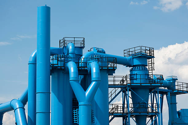 New Blue Industrial Installations Against Sky "blue industrial pipes,click here to view more related images:" large machine stock pictures, royalty-free photos & images