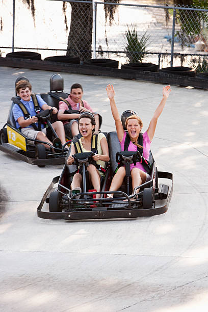istock Teenagers riding go-carts 184089741
