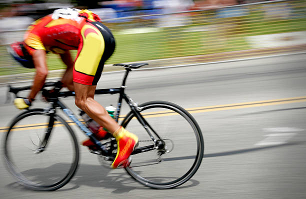 istock Professional cyclist races on road with head down 184089848