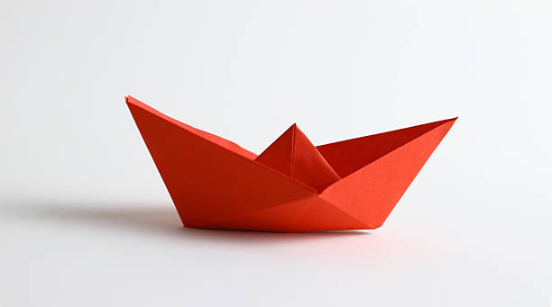 Red origami boat stock photo