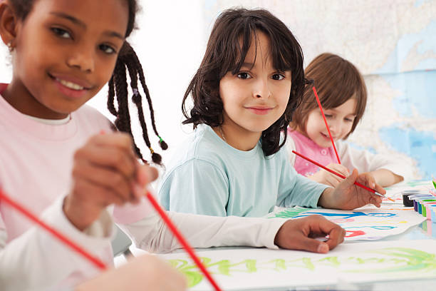 istock Three children painting with watercolors. 184090589