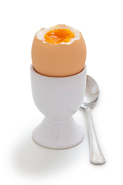 Boiled Egg. Boiled egg in an eggcup isolated on white. boiled egg cut out stock pictures, royalty-free photos & images