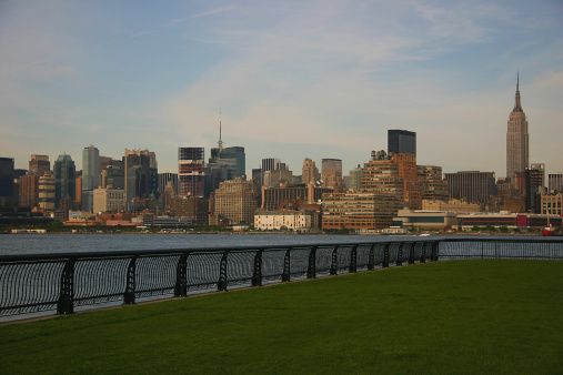 British Airways Concorde supersonic jet removed from Intrepid Sea, Air & Space Museum on August 9, 2023 and taking a barge ride to Brooklyn for a makeover and restoration. \nI photographed this historical event with famous Manhattan landmark buildings and iconic skyscrapers in New York city  from Weehawken / Hoboken, New Jersey