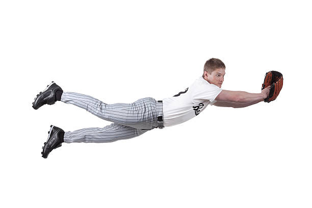 istock Baseball fielder diving to catch the ball 184091032