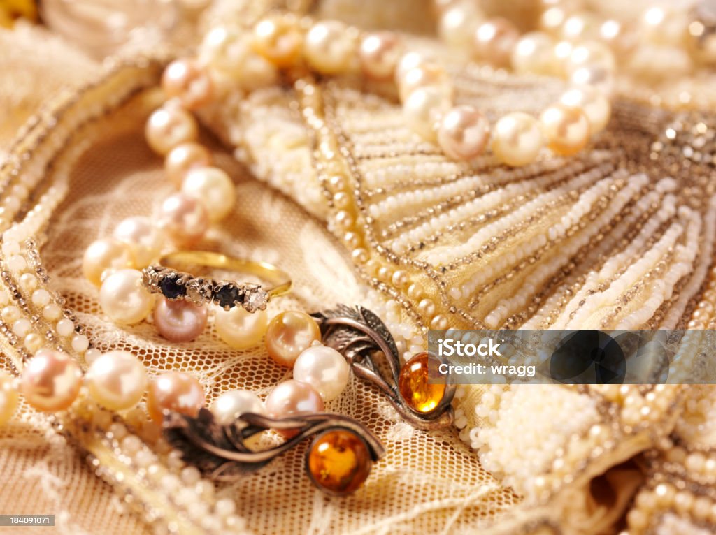 Beaded Bag and Vintage Jewellery Vintage feminine jewellery collection on a beaded bag.Click on the link below to see more of my antiques and collectable images. Jewelry Stock Photo