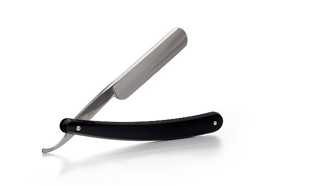 Straight Razor (classic) "An unused Classic Straight Razor, old style, in soft diffuse light. Execent depth of field, covering the entire razor plane. This photo has been retouched." razor blade stock pictures, royalty-free photos & images