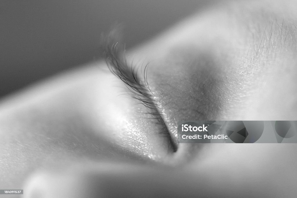 Dreamy Lashes A Newborn baby's eyelashes close up while sleeping. Black and white Baby - Human Age Stock Photo