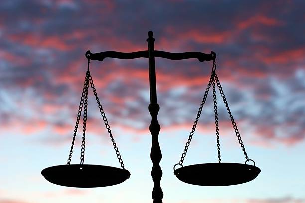 istock Balance Scales Against Evening Sky 184091717