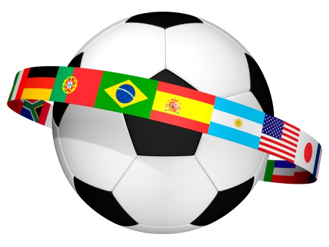 Qatar versus Ecuador football in brightly lit outdoor stadium with painted country flag. Focus on foreground and soccer ball with shallow depth of field on background and copy space.