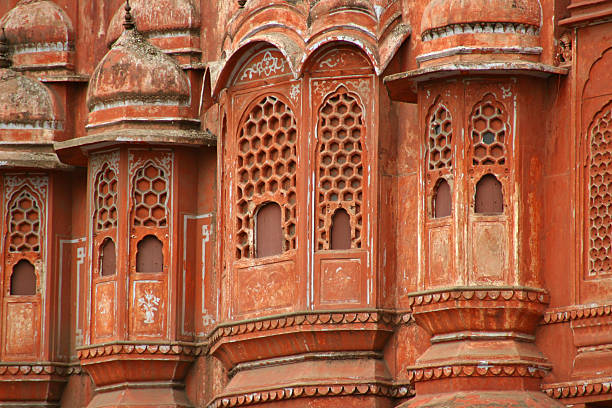 Subject: Hawa Mahal, “Palace of Wind” in Jaipur, India. Detail of the red sandstone palace harem wall with numerous windows.