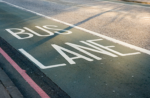 'Bus lane' written on tarmac.