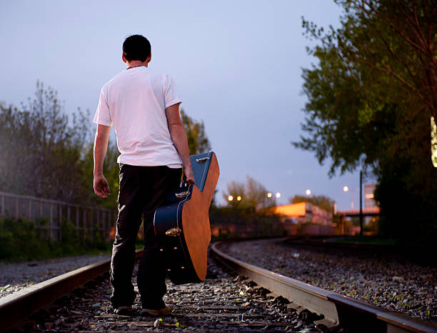 walking on railroad at dusk