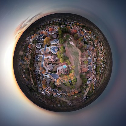 360 degree tiny planet view of an upscale subdivision in suburbs of USA