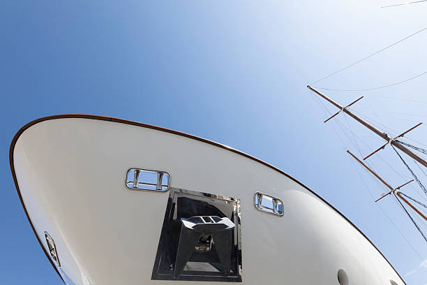 istock Modern motor yacht and old sailboat under the sun 184095536
