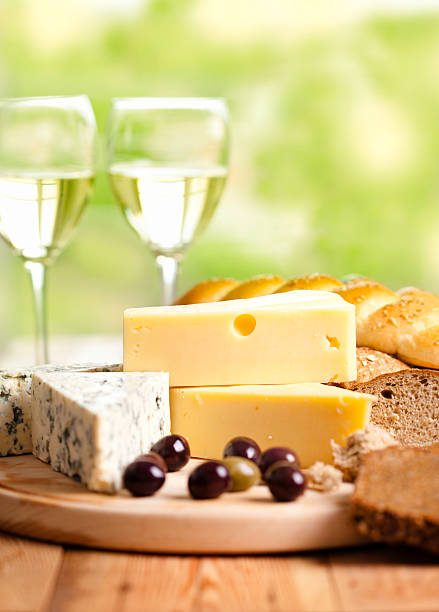 istock White wine whit cheese and olives 184095556