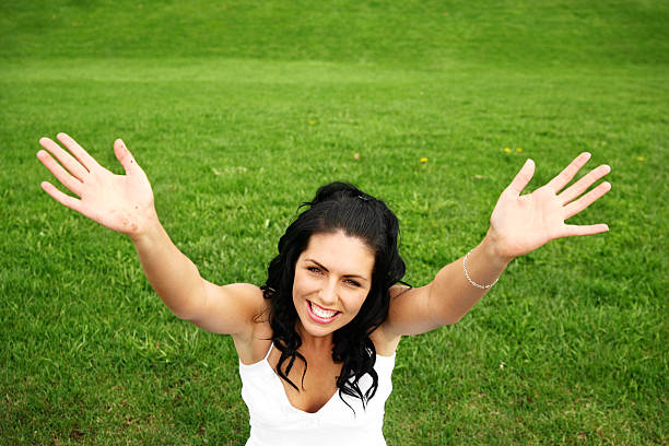 istock Happy woman in the grass 184095573
