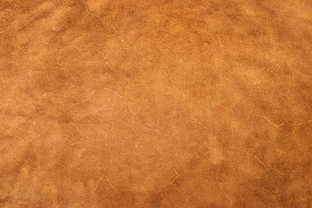 Golden Leather A detailed image of a large piece of leather. leather stock pictures, royalty-free photos & images