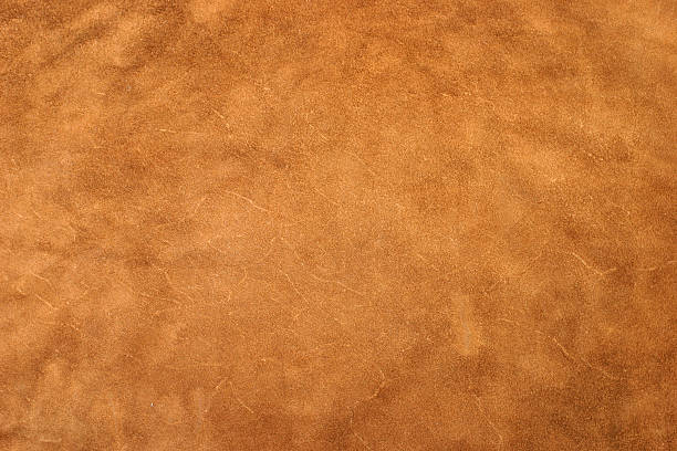 Golden Leather A detailed image of a large piece of leather. brown stock pictures, royalty-free photos & images