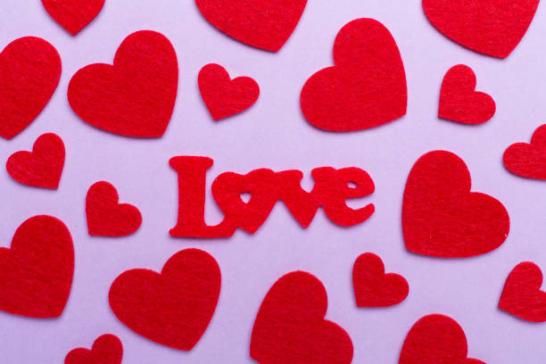 istock Felt word love with hearts on color background, top view 1840958002