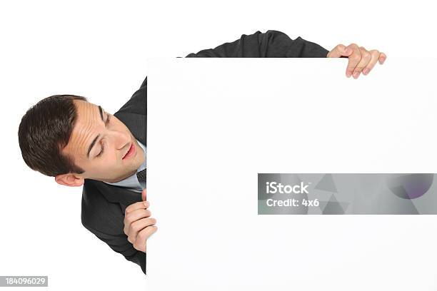 Businessman Holding Placard Stock Photo - Download Image Now - 20-29 Years, Adult, Adults Only