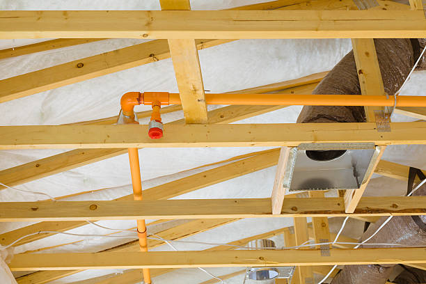 Fire sprinkler system on the exposed beams of a building stock photo